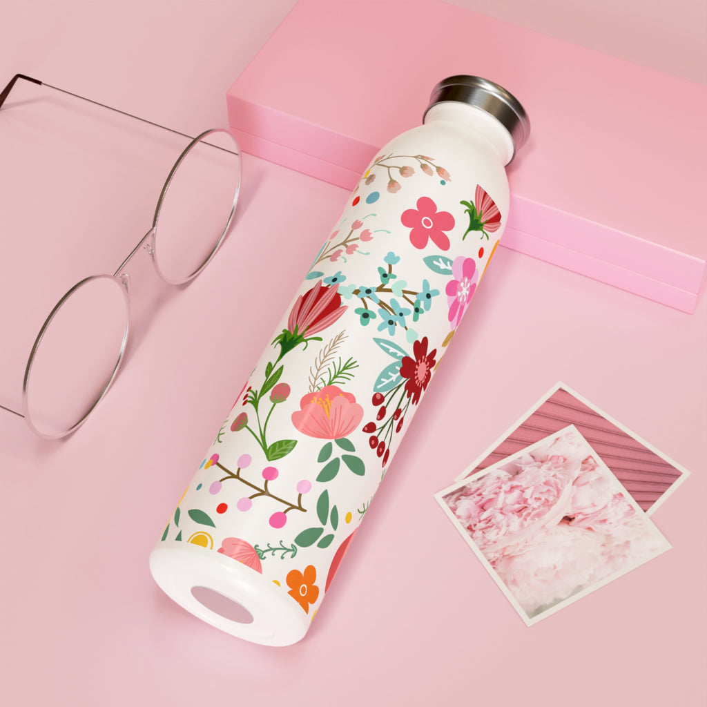 Floral Stainless Steel Water Bottle - 20oz, Eco-Friendly, Double-Wall Construction for Hot/Cold Drinks. Vibrant floral design wrapped around the bottle. Sustainable hydration with style from Pugs in Mugs Creations.